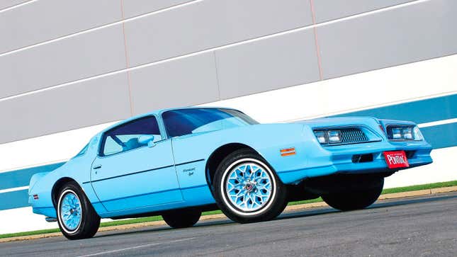 A blue Pontiac Firebird muscle car 