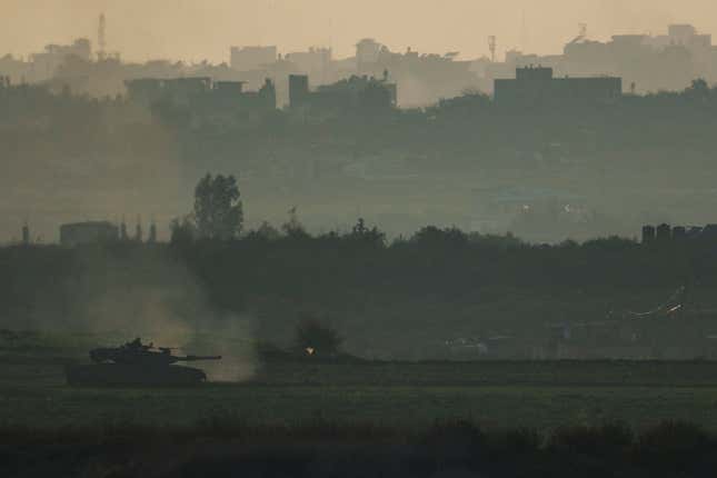 An Israeli tank moves inside the Gaza Strip as seen from southern Israel, Tuesday, Jan. 16, 2024. (AP Photo/Leo Correa)