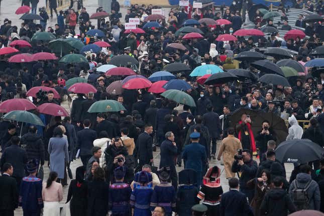 Delegates leave after the opening session of the The National People&#39;s Congress (NPC) at the Great Hall of the People in Beijing, China, Tuesday, March 5, 2024. (AP Photo/Andy Wong)