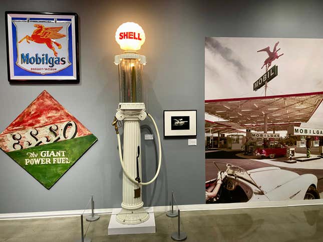 A snapshot of a portion of the gas station section of the gallery showing off a vintage Shell gas pump and a real Andy Warhol Mobilgas sign