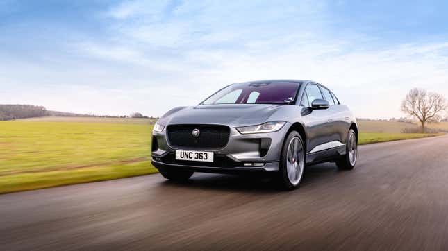 A Jaguar I Pace driving on a rural road