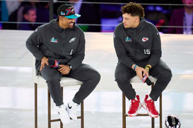 PHOENIX, AZ - FEBRUARY 06: Jalen Hurts #1 of the Philadelphia Eagles speaks with Patrick Mahomes #15 of the Kansas City Chiefs at Footprint Center on February 6, 2023 in Phoenix, Arizona.