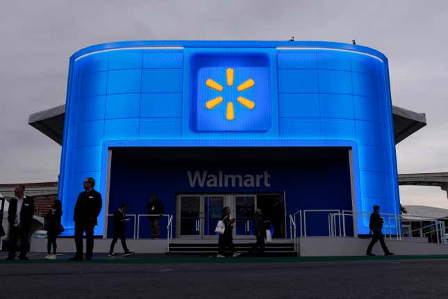 People walk by the Walmart booth during the CES tech show Tuesday, Jan. 9, 2024, in Las Vegas. (AP Photo/John Locher)