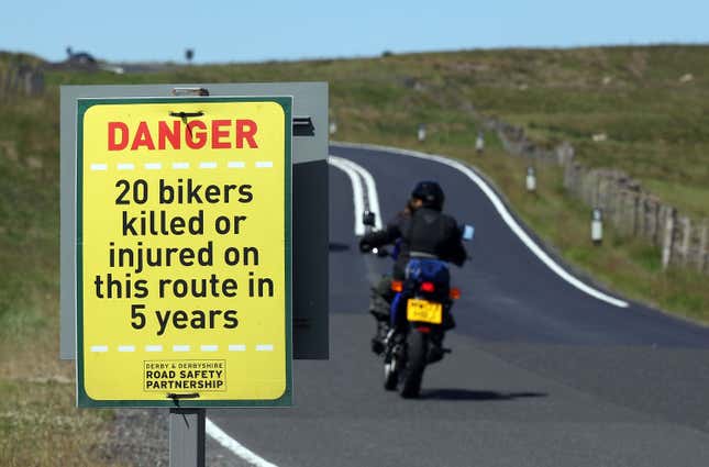 A motorcyclist travels along the United Kingdom's most dangerous road, the A537 Macclesfield to Buxton on June 30, 2010 in Macclesfield, England