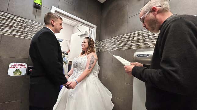 Image for article titled Couple Marries Inside Disco-Themed Gas Station Men&#39;s Bathroom