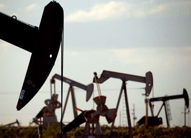 FILE - Pumpjacks work in a field near Lovington, N.M., on April 24, 2015. A windfall in government income from petroleum production is slowing down but far from over in New Mexico as the nation&#39;s No. 2 oil production state grapples with how much it can effectively spend — and how to set aside billions of dollars for the future in case the world&#39;s thirst for oil falters. The state is headed for a $3.5 billion general fund surplus for the year running through June 2025, according to a new forecast Monday, Dec. 11, 2023. (AP Photo/Charlie Riedel, File)