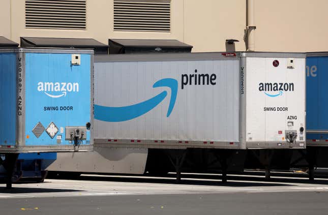 blue Amazon Prime logo is displayed on the side of a white Amazon delivery truck