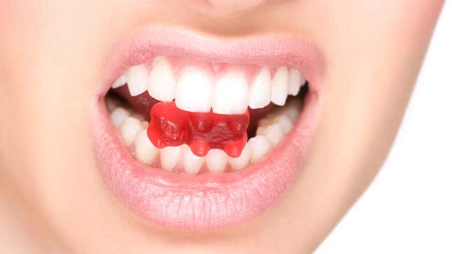 mouth chewing on gummy bear