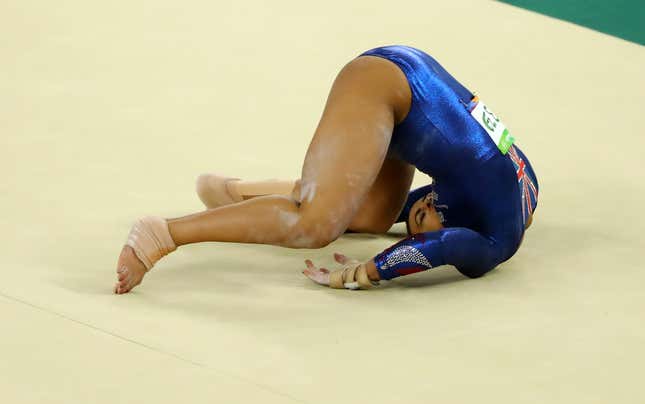 Elissa Downie of Britain falls and injures herself during the women's artistic gymnastics qualifications at the Rio 2016 Olympics.