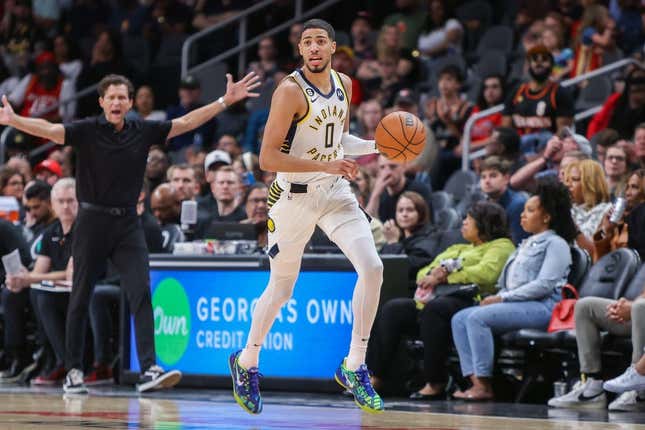 Mar 25, 2023; Atlanta, Georgia, USA; Indiana Pacers guard Tyrese Haliburton (0) dribbles against the Atlanta Hawks in the second quarter at State Farm Arena.