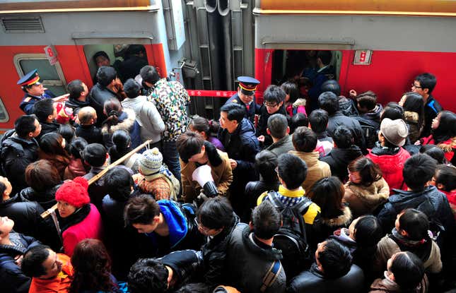 Passengers rush to board trains at Changsha Railway Station, Hunan province January 8, 2012. Chinese New Year, or Spring Festival, is the bigger of two "Golden Week" holidays, giving migrant workers their only chance of the year to return to their home provinces with gifts for their families. More than 200 million people are expected to take to the railways over this year's holiday, the biggest movement of humanity in the world. Picture taken January 8, 2012. REUTERS/China Daily (CHINA - Tags: SOCIETY TRANSPORT) CHINA OUT. NO COMMERCIAL OR EDITORIAL SALES IN CHINA - GM1E8190Y3C01