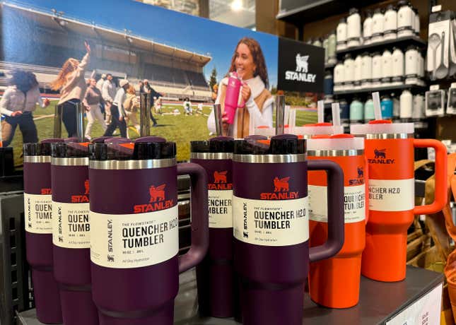 Stanley cups on a display shelf at Dick's Sporting Goods