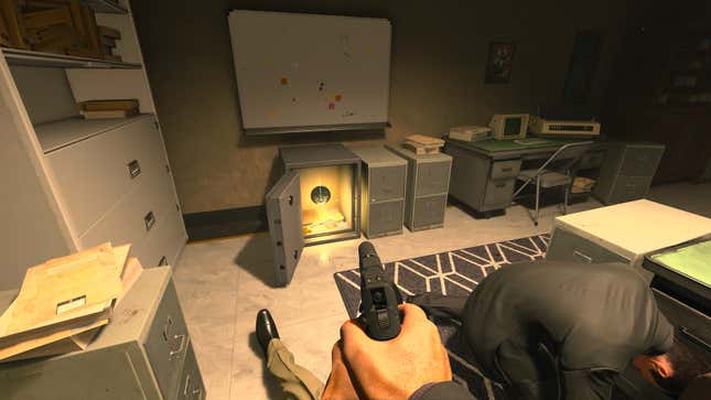 The player holds a gun as they look at an open safe with a giant coin inside.