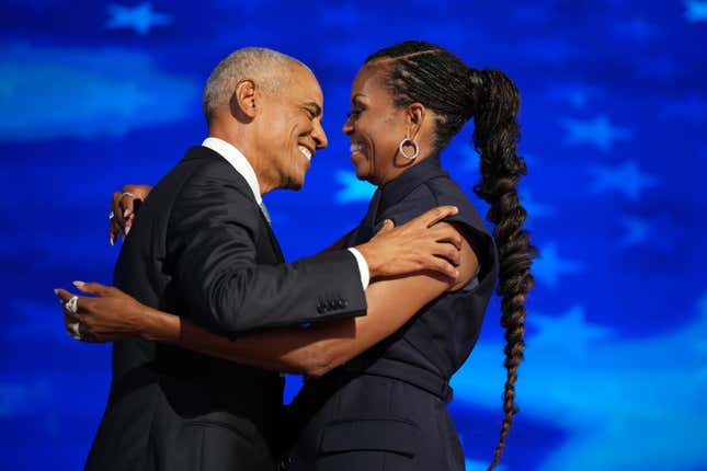 UNITED STATES - AUGUST 20: Former President Barack Obama and former first lady Michelle Obama appear on stage in between their addresses on the second night of the Democratic National Convention at the United Center in Chicago, Ill., on Tuesday, August 20, 2024. 