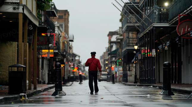A man stands in middle of a street in the French Quarter of New Orleans ahead of the arrival of Hurricane Ida.