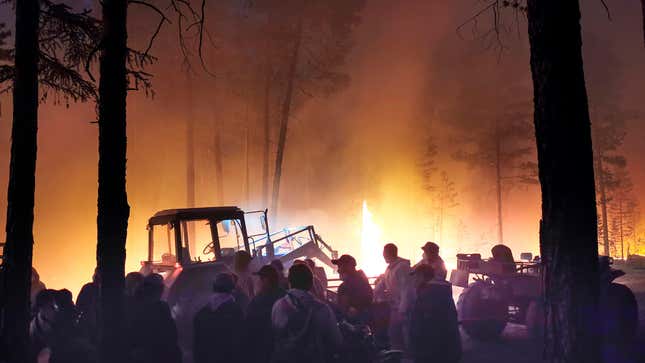 Volunteers prepare to douse a forest fire in the republic of Sakha also known as Yakutia, Russia Far East, Saturday, July 17, 2021.