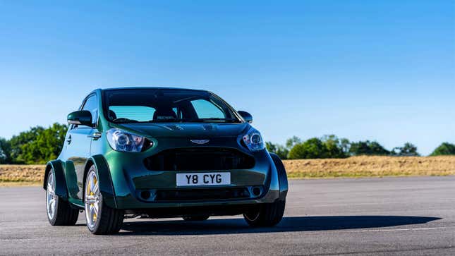 A photo of a green Aston Martin Cygnet city car. 