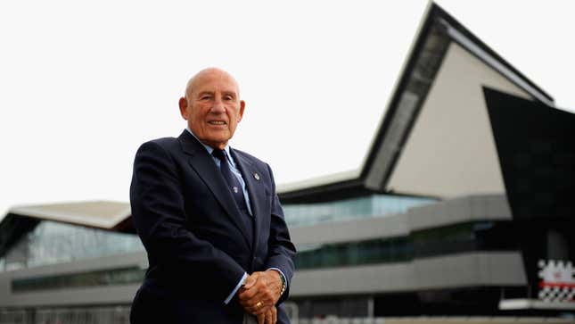 Stirling Moss stands outside the new wing of the Silverstone complex. 