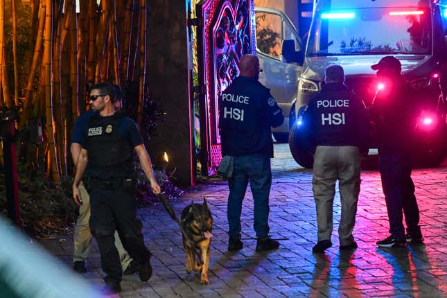 Homeland Security Investigation agents are seen at the entrance of US producer and musician Sean “Diddy” Combs’s home at Star Island in Miami Beach on March 25, 2024. Homes belonging to Sean “Diddy” Combs were being raided by federal agents, media reported on March 25, with the US hip hop mogul at the center of sex trafficking and sex assault lawsuits.