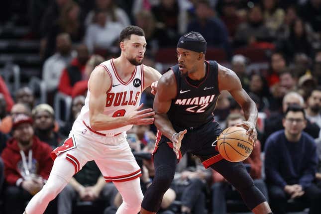 Nov 20, 2023; Chicago, Illinois, USA; Chicago Bulls guard Zach LaVine (8) defends against Miami Heat forward Jimmy Butler (22) during the first half at United Center.