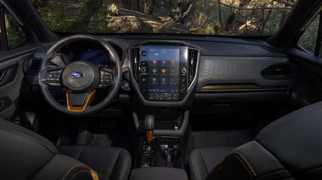 A photo of the interior of hte new forester wilderness showing the bronze accents and center touchscreen 