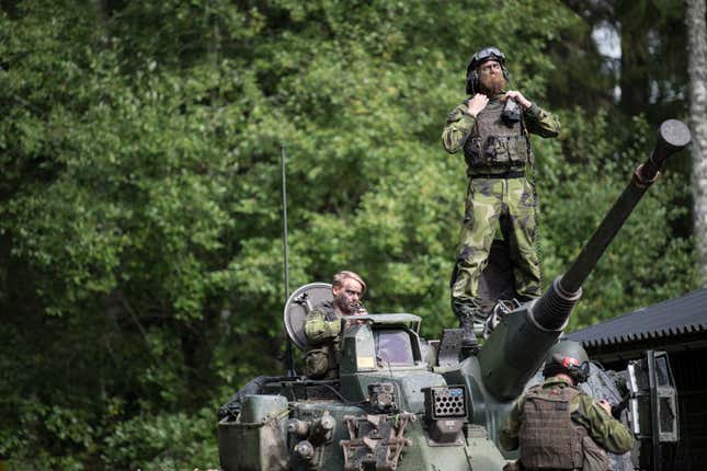 FILE - Swedish soldiers from Skaraborg&#39;s Swedish regiments take part in a training exercise as part of the preparations for Aurora 17 field exercise, in Skovde, Sweden, on Sept. 14, 2017. The Swedish government said Monday Sept. 11, 2023 it wants to increase its defense budget by 28%, putting it on track to reach the spending target 2% of gross domestic product set by the NATO alliance, which the Scandinavian country is preparing to join. (Bjorn Larsson Rosvall/TT News Agency via AP, File)