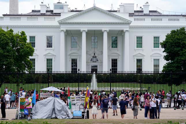 FILE - People gather on a section of Pennsylvania Avenue in front of the White House, July 4, 2021, in Washington. The Biden administration on Wednesday, Feb. 7, 2024, will name Elizabeth Kelly, a top White House aide, as the director of the newly established safety institute for artificial intelligence. (AP Photo/Patrick Semansky, File)