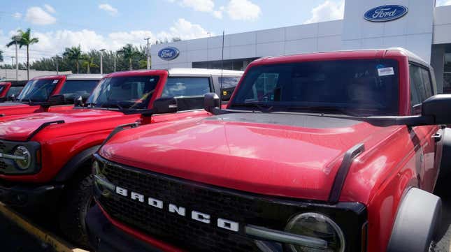 Ford Broncos line the the front of Gus Machado's Ford dealership, Monday, Jan. 23, 2023, in Hialeah, Florida.