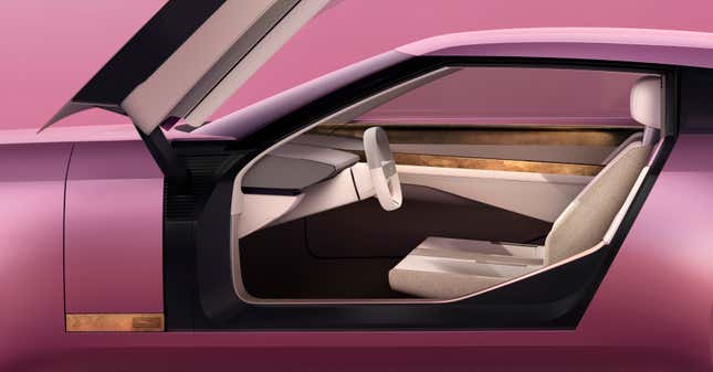 Open door of the pink Jaguar Type 00 concept showing the interior