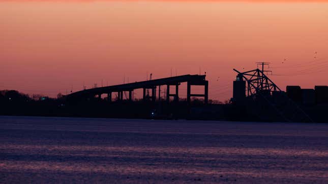 he sunsets on the collapsed Francis Scott Key Bridge on March 28, 2024 in Baltimore, Maryland. 