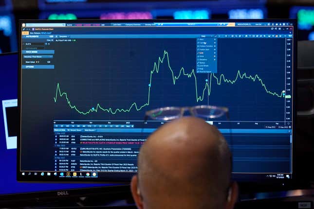 A trader looks at his screen on the floor of the New York Stock Exchange, Wednesday, Sept. 13, 2023. Stocks are churning in place on Wall Street after a highly anticipated report showed inflation accelerated across the country last month, but not by much more than expected. (AP Photo/Richard Drew)