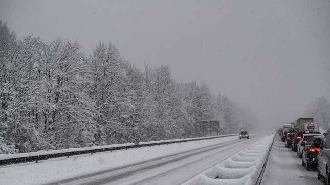 Cars driving on a snow-covered highway 