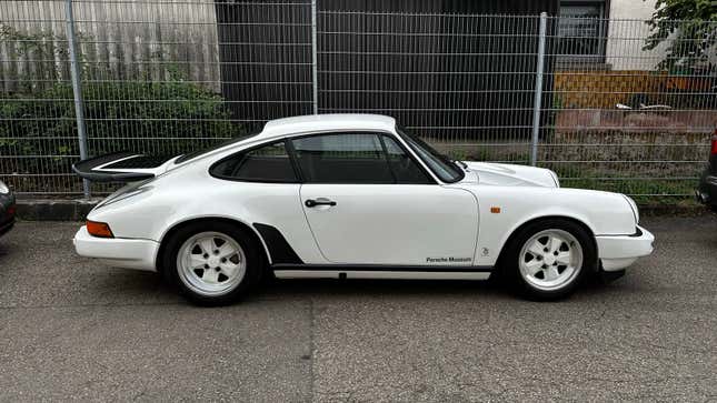 The Porsche 3.2 Carrera Clubsport prototype photographed in front of Porsche's secret historical warehouse