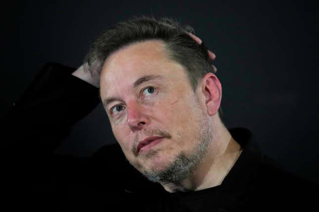 FILE - Elon Musk appears at an event with Britain&#39;s Prime Minister Rishi Sunak in London, on Nov. 2, 2023. According to Musk, the first human received an implant from his computer-brain interface company Neuralink over the weekend. (AP Photo/Kirsty Wigglesworth, Pool, File)