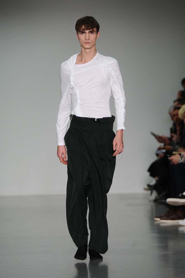 LONDON, ENGLAND - JANUARY 12: A model walks the runway during the Craig Green show at the London Collections: Men AW15 at Victoria House on January 12, 2015 in London, England. (Photo by Stuart C. Wilson/Getty Images)