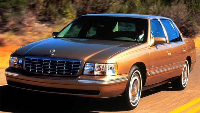 A brown Cadillac Deville sedan