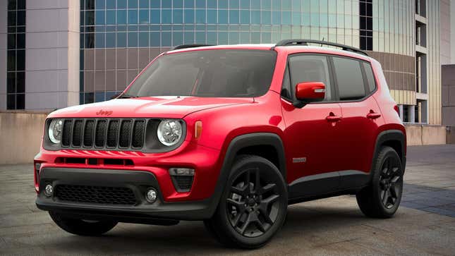 Un Renegade rojo estacionado frente a un edificio