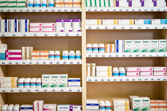 Shelves stacked with medicines - stock photo