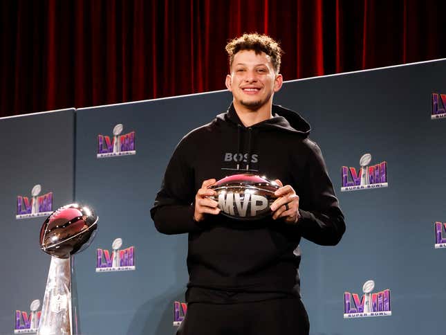 Quarterback Patrick Mahomes #15 of the Kansas City Chiefs pose after being presented the Pete Rozelle Trophy as Super Bowl LVIII Most Valuable Players during the Super Bowl Winning Team Head Coach and MVP Press Conference at the Mandalay Bay North Convention Center on February 12, 2024 in Las Vegas, Nevada.