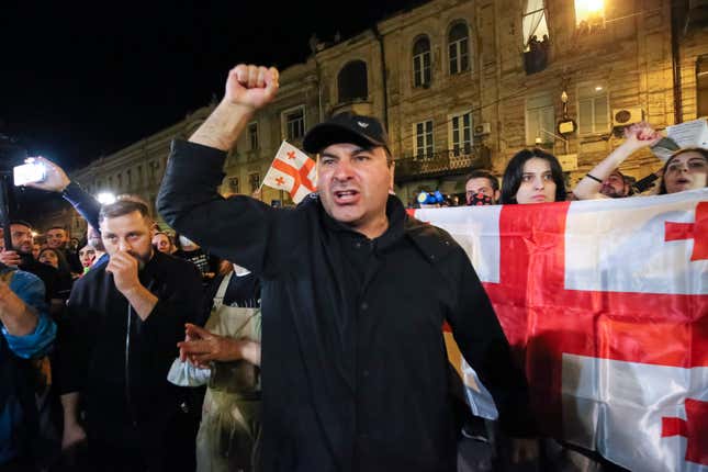 A demonstrator gestures as he shouts during a rally outside the parliament building in Tbilisi, Georgia, on Thursday, April 18, 2024, to protest against &quot;the Russian law&quot; similar to a law that Russia uses to stigmatize independent news media and organizations seen as being at odds with the Kremlin. (AP Photo/Zurab Tsertsvadze)