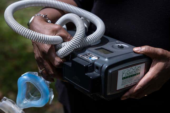 Jenny Shields poses for a photo with her CPAP machine, which was recalled for safety reasons, at her home in Wilmington, Delaware on June 3, 2022. 
