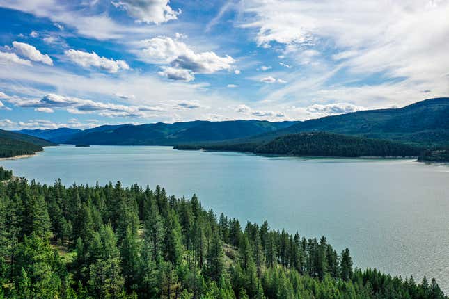 FILE - Lake Koocanusa is seen, June 16, 2021, northeast of Libby, Mont. Rising levels of the mining byproduct selenium is harming water quality, fish and other aquatic life in the lake along the U.S.-Canada border. Officials from the U.S., Canada and several indigenous groups announced a proposal Monday, March 11, 2024, to address longstanding pollution from coal mining in British Columbia that&#39;s contaminating waterways and harming fisheries on both sides of the border. (Hunter D&#39;Antuono/Flathead Beacon via AP, File)