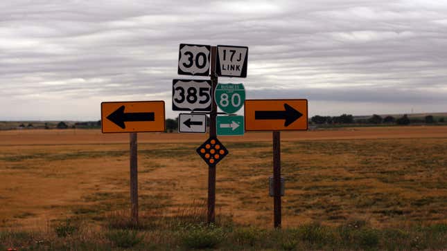 A photo of road signs in Nebraska pointing to different highways. 