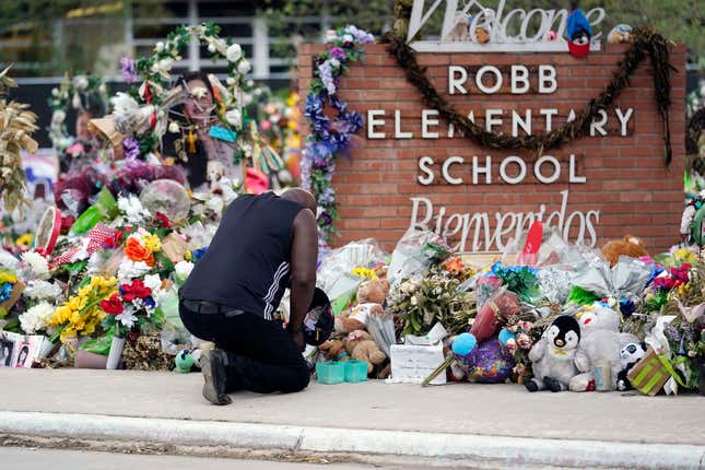  Reggie Daniels pays his respects at a memorial at Robb Elementary School in Uvalde, Texas, on June 9, 2022, honoring the two teachers and 19 students killed in the shooting at the school on May 24.