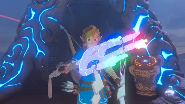 A Breath of the Wild image shows Link holding a piece of Sheikah Technology. 
