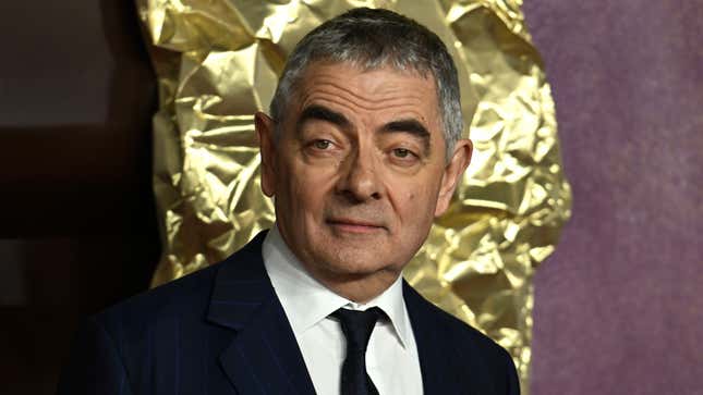 A photo of Rowan Atkinson at a movie premiere. 