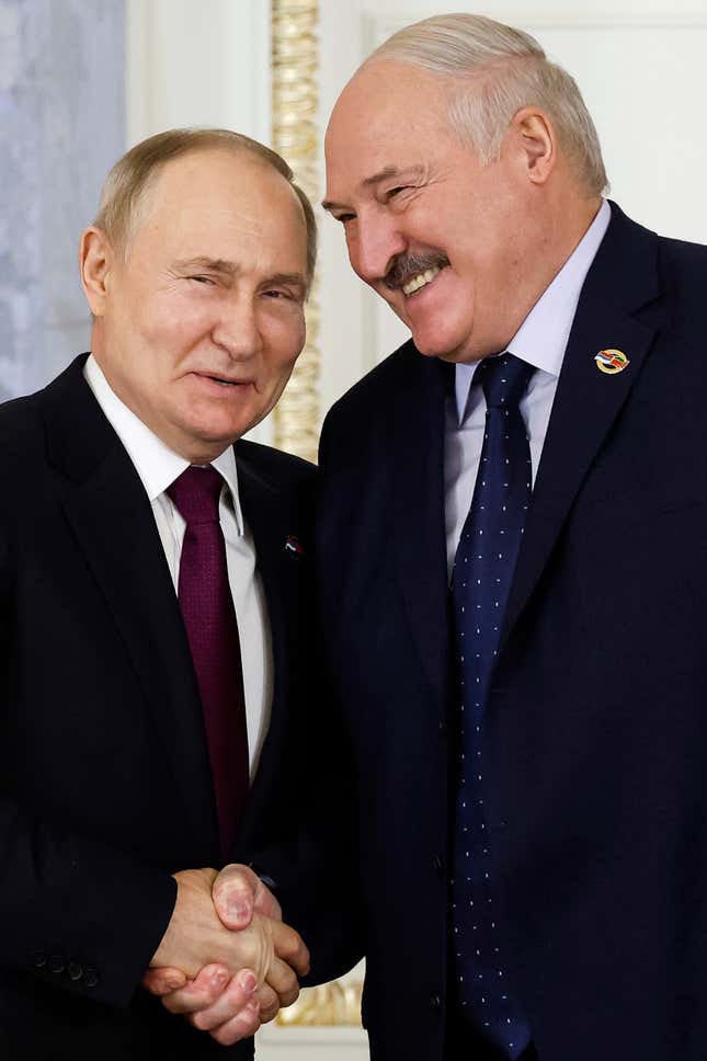 Russian President Vladimir Putin, left, and Belarus President Alexander Lukashenko shake hands during a meeting of the Union State Supreme Council in St. Petersburg, Russia, Monday, Jan. 29, 2024. (Dmitry Astakhov, Sputnik, Government Pool Photo via AP)