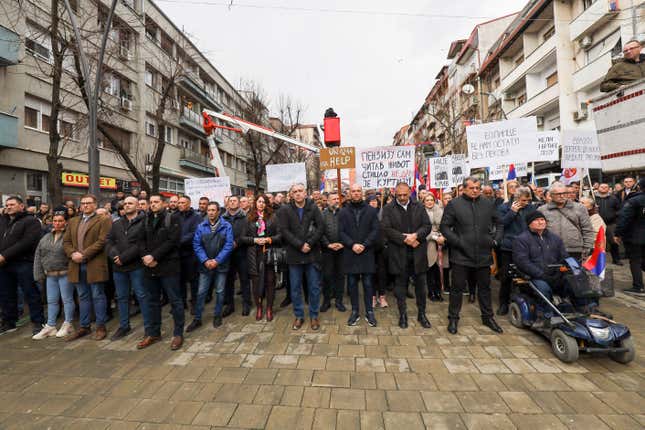 Kosovo Serbs protest against a ban of the use of the Serbian currency in areas where they live, in the northern part of Kosovska Mitrovica, Kosovo, Monday, Feb. 12, 2024. Thousands of minority Serbs in Kosovo on Monday protested a ban of the use of the Serbian currency in areas where they live, an issue that has been the cause of the latest crisis in relations between Serbia and Kosovo. (AP Photo/Bojan Slavkovic)