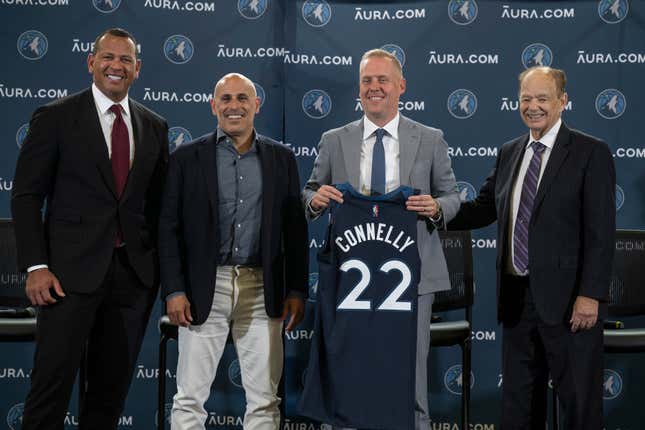 FILE - Minnesota Timberwolves Ownership Group Alex Rodriguez, left, Marc Lore,, second from left, and Glen Taylor, right, pose for a photo with Timberwolves new President of Basketball Operations Tim Connelly (holding jersey) in Minneapolis, Tuesday, May 31, 2022. The ownership transfer of the Timberwolves slammed to a halt when Taylor declared on Thursday, March 27, 2024, he won&#39;t take the final step of his drawn-out $1.5 billion deal to hand Marc Lore and Alex Rodriguez the majority stake because they didn&#39;t meet all of the deadlines in the sale conditions. (Jerry Holt/Star Tribune via AP, File)