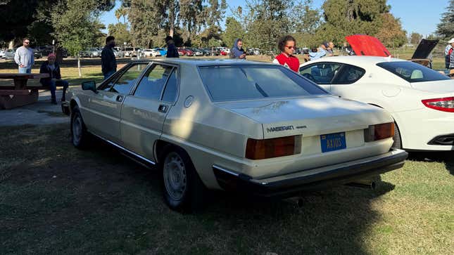 Rear 3/4 view of a yellow Maserati Quattroporte III